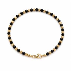 cdd3c761-e239-4017-60e3-08dee72f1c84.jpg Manilla Black and gold beaded 14k Size 7.5'' Weight 3.8gr